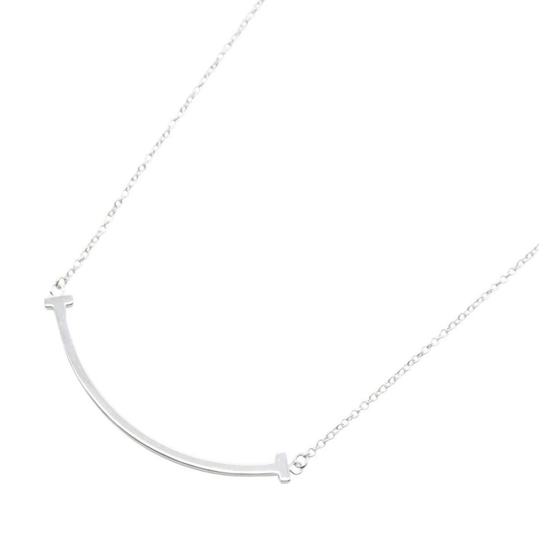Tiffany & Co. T Smile Small Necklace, 18K White Gold (WG), Women's, Silver Tone: --- Catalog ---Category: SizePendant Size: 37mm x 3mm / 1.45'' x 0.11''Neck Circumference: 40 cm - 45 cm / 15.74'' - 17.71''Category: DesignColor: SilverGender: WomenMaterial: White gold (18K)Necklace