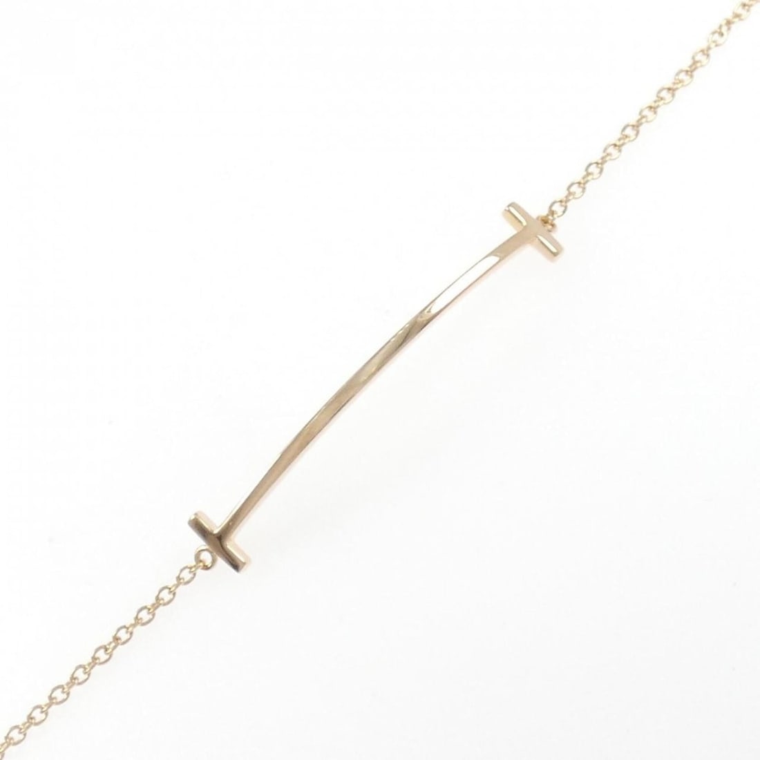 Tiffany T Smile Bracelet: --- Catalog ---Category: SizeLength: 15.5cm / 6.1''Category: DesignType: Charm braceletColor: Pink goldGender: WomenMaterial: Pink gold (18K)Category: GeneralBrand: Tiffany--- Item List ---Section: Co