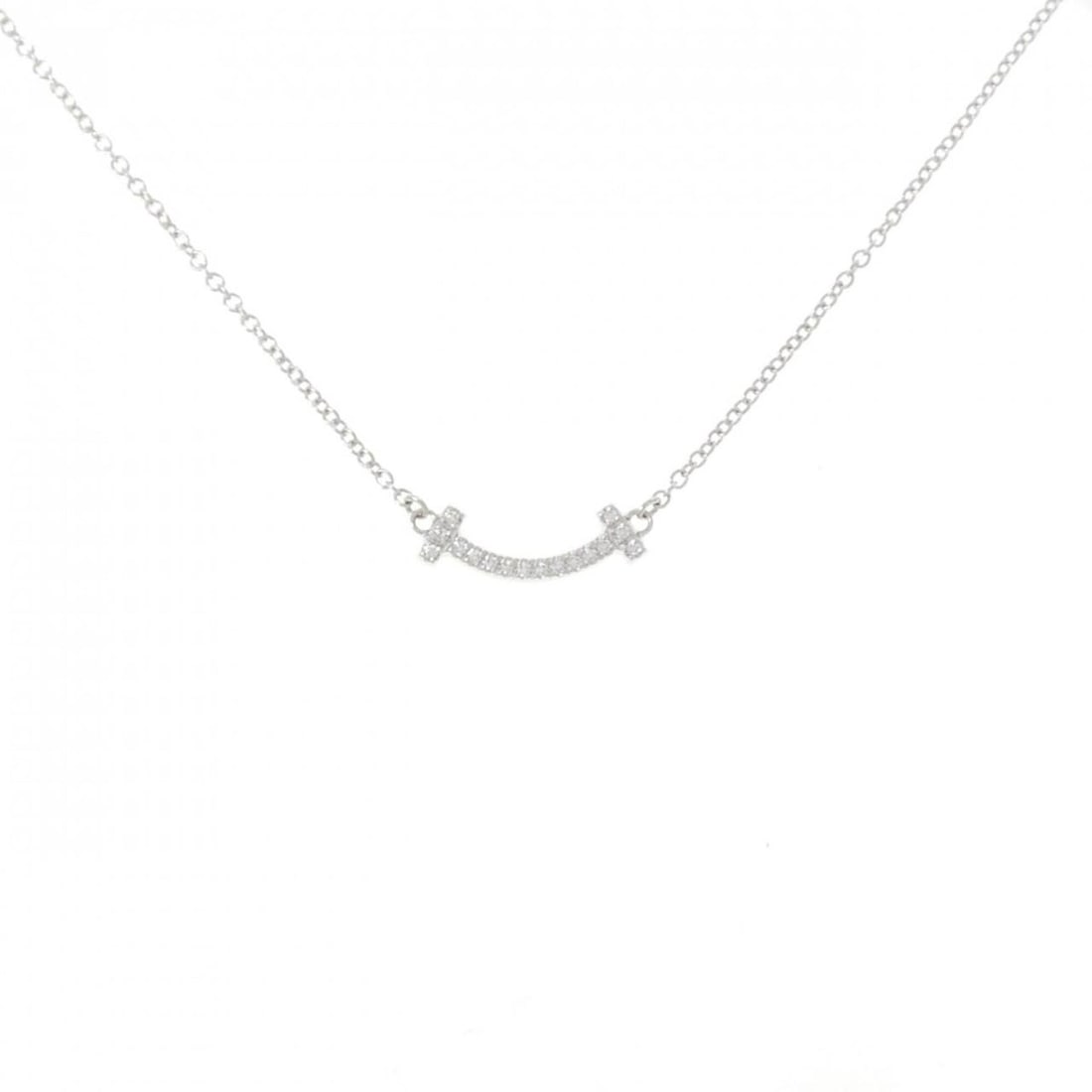 Tiffany T Smile Mini Necklace: --- Catalog ---Category: SizePendant Size: 4.5mm x 13.3mm / 0.17'' x 0.52''Neck Circumference: 41 cm - 45 cm / 16.14'' - 17.71''Category: DesignColor: White goldStone: DiamondGender: WomenMaterial: