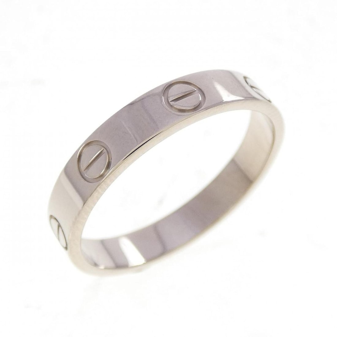 Cartier Mini Love Ring: --- Catalog ---Category: SizeUS Size: 7.5Brand Size: 55Category: DesignType: Band ringColor: White goldGender: Women,MenMaterial: White gold (18K)Category: GeneralBrand: Cartier--- Item List ---Sectio