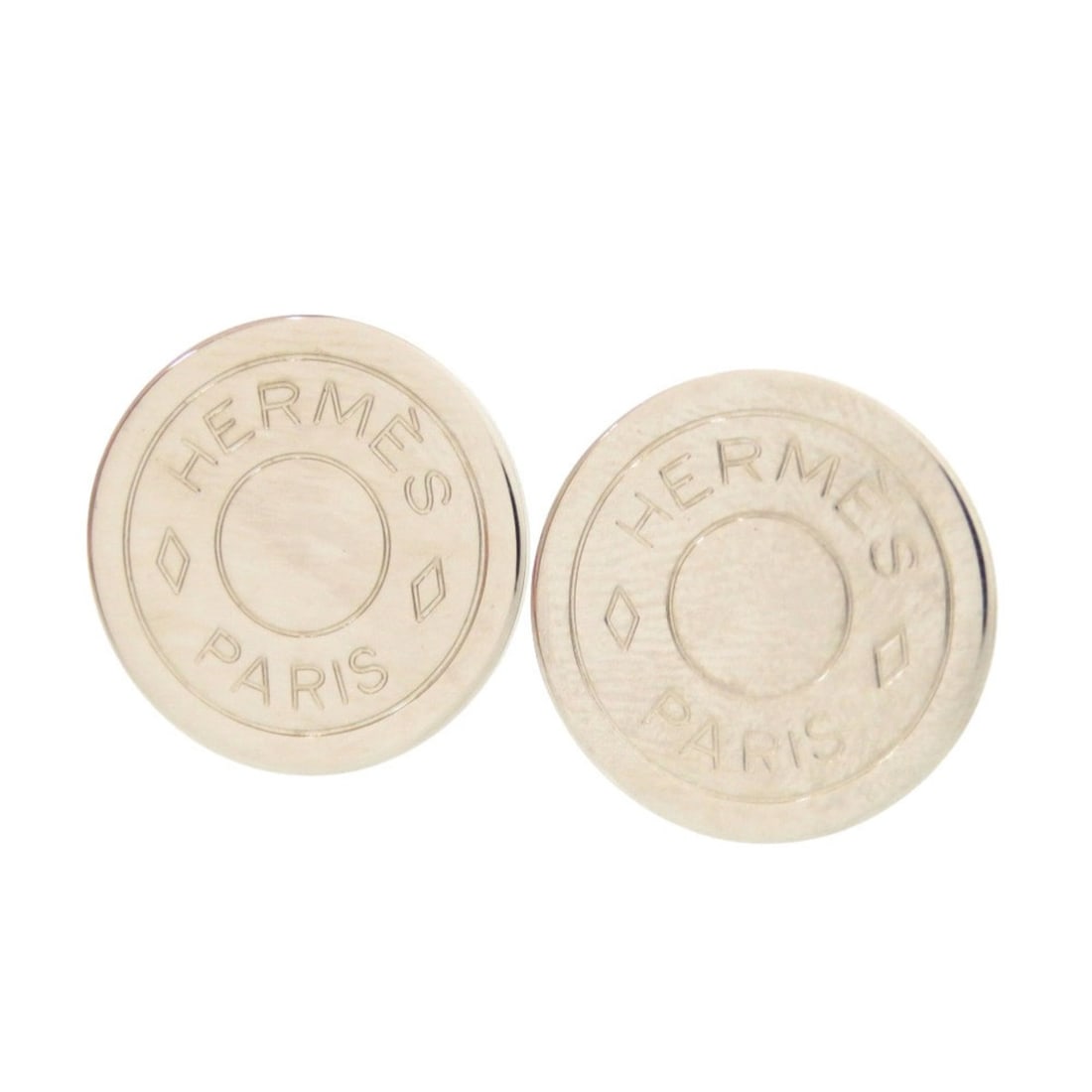 Hermes Sellier Silver Earrings, Accessory 1655 HERMES: --- Catalog ---Category: SizeSize (HxWxD): 20.00mm x 20.00mm / 0.79'' x 0.79''Category: DesignType: Clip earringsColor: SilverGender: WomenMaterial: MetalCategory: GeneralLine: SellierBrand: Hermes---
