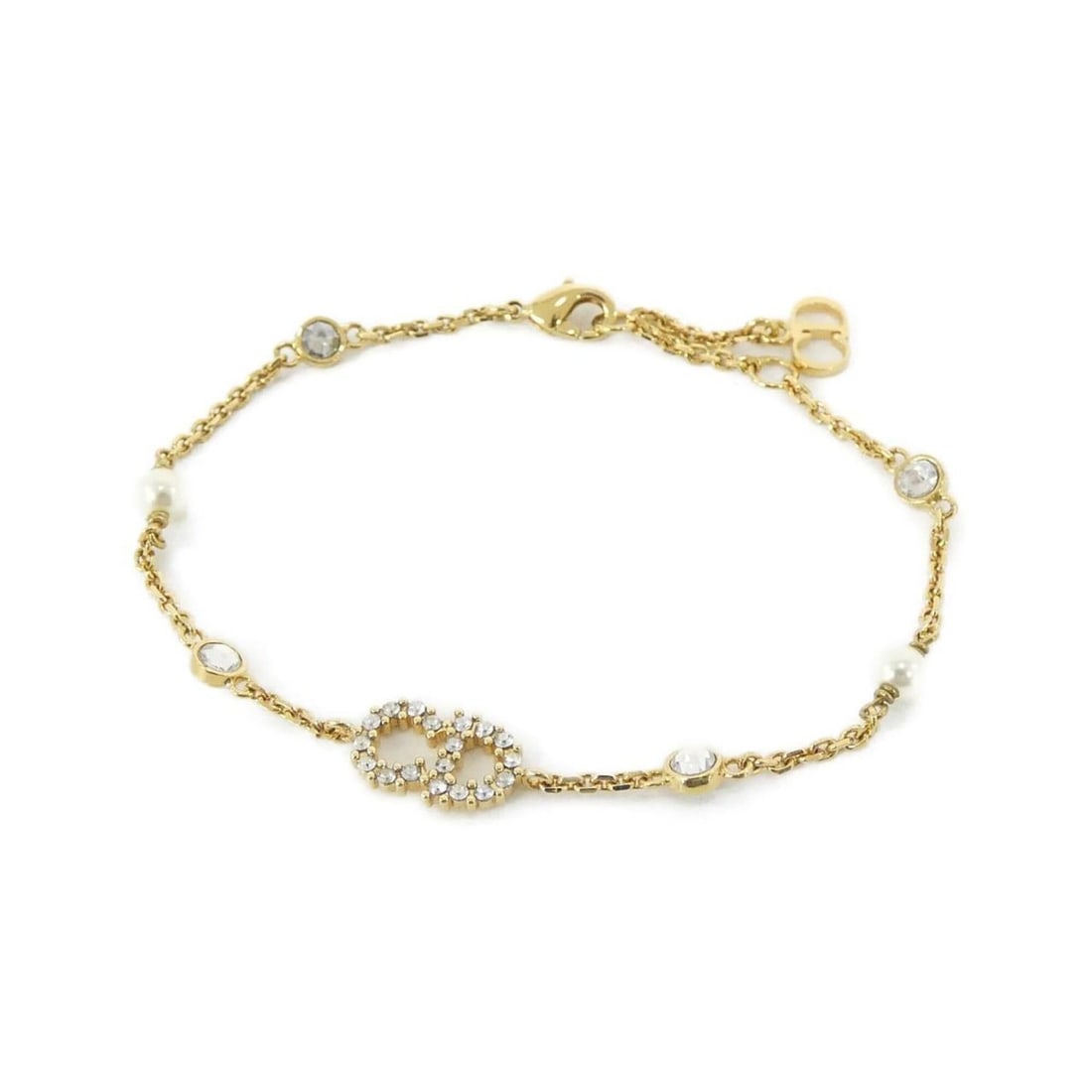 Christian Dior Claire Di Lune B0668CDLCY Bracelet: --- Catalog ---Category: SizeLength: 16cm - 18cm / 6.29'' - 7.08''Category: DesignType: Charm braceletColor: Clear, Gold, WhiteGender: WomenCategory: GeneralBrand: Christian DiorModel: B0668CDLCY---