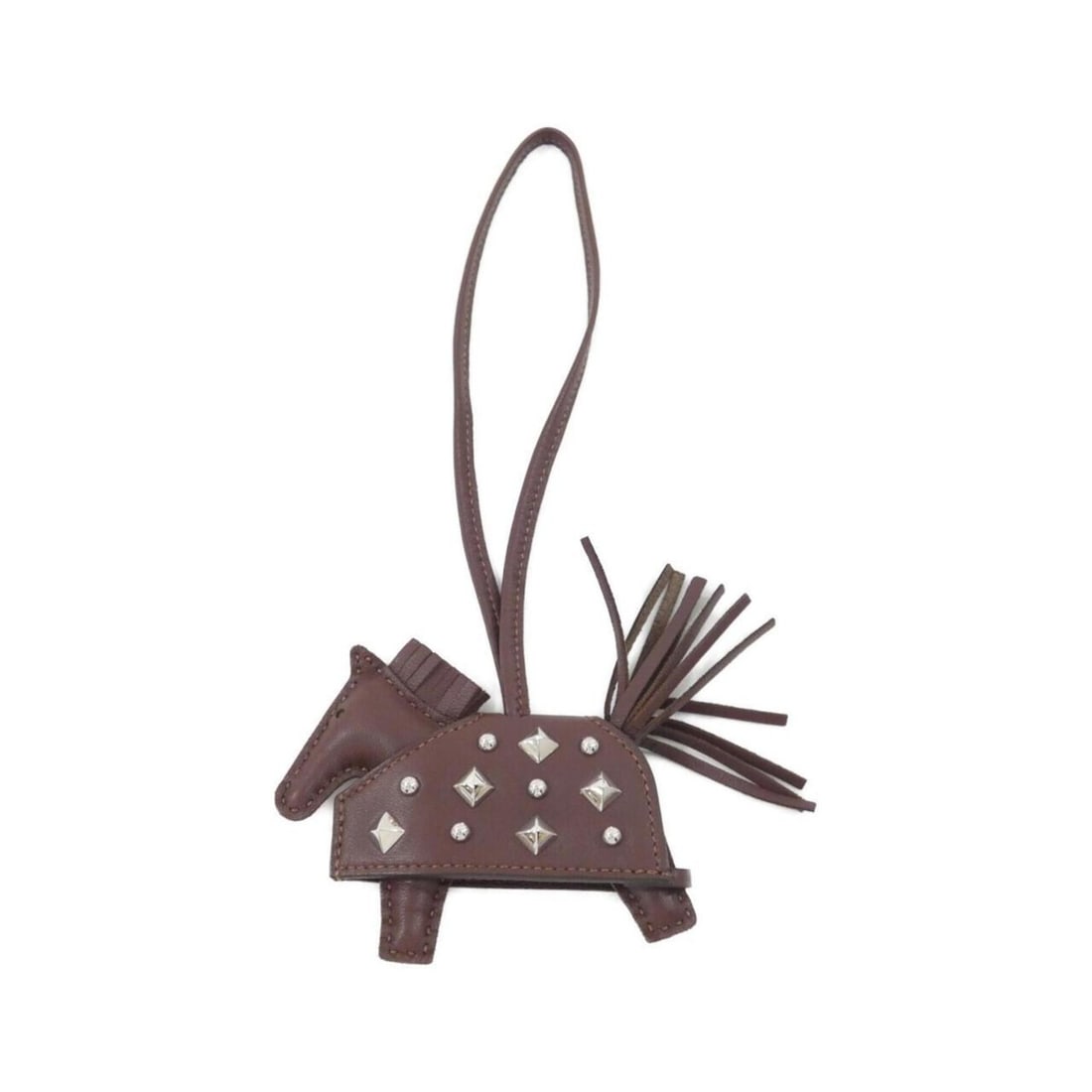 Hermes Rodeo Robeo Lock PM 086961CK Accessory Bag Charm: --- Catalog ---Category: SizeSize (HxWxD): 75.00mm x 85.00mm / 2.95'' x 3.35''Category: DesignType: Handbag charmColor: Brown, SilverGender: WomenMaterial: Agneau MiloCategory: GeneralMPN: 086961CKBra