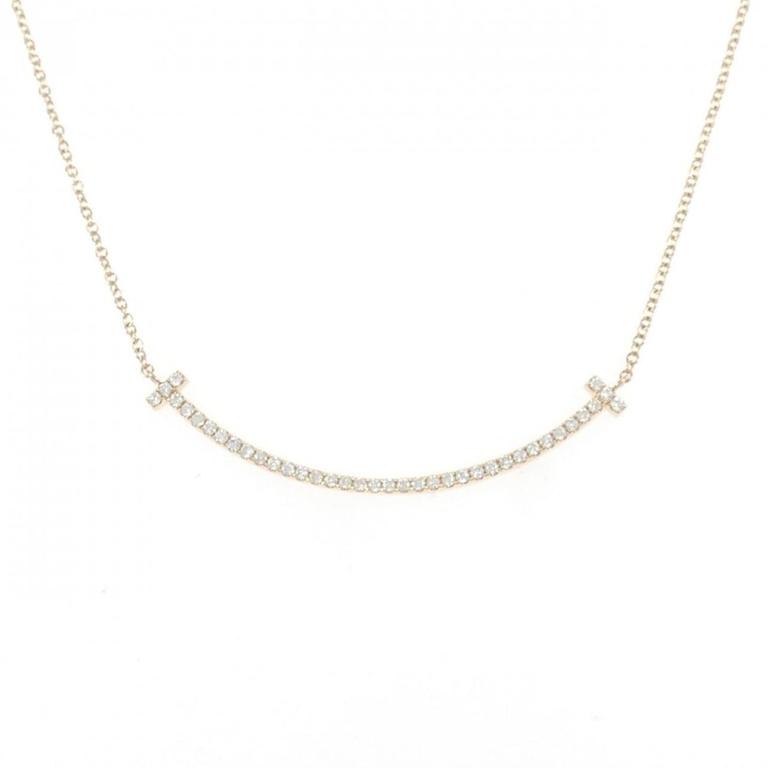 Tiffany T Smile Small Necklace: --- Catalog ---Category: SizePendant Size: 3.5mm x 37.3mm / 0.13'' x 1.46''Neck Circumference: 41 cm / 16.14''Category: DesignColor: Pink goldGender: WomenMaterial: Pink gold (18K)Pendant Type: