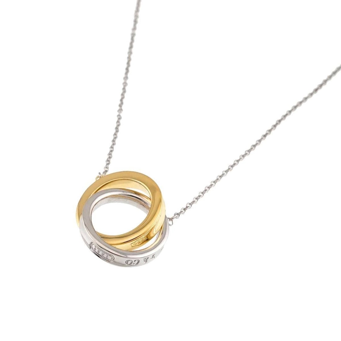Tiffany & Co. 1837 Interlocking Necklace, 40cm, SV (925 Sterling Silver) and 18K (750 Yellow Gold): --- Catalog ---Category: SizePendant Size: 14.3mm x 24.3mm / 0.56'' x 0.95''Neck Circumference: 40 cm / 15.74''Category: DesignColor: Silver, Yellow goldGender: WomenMaterial: Silver 925, Yellow gold 
