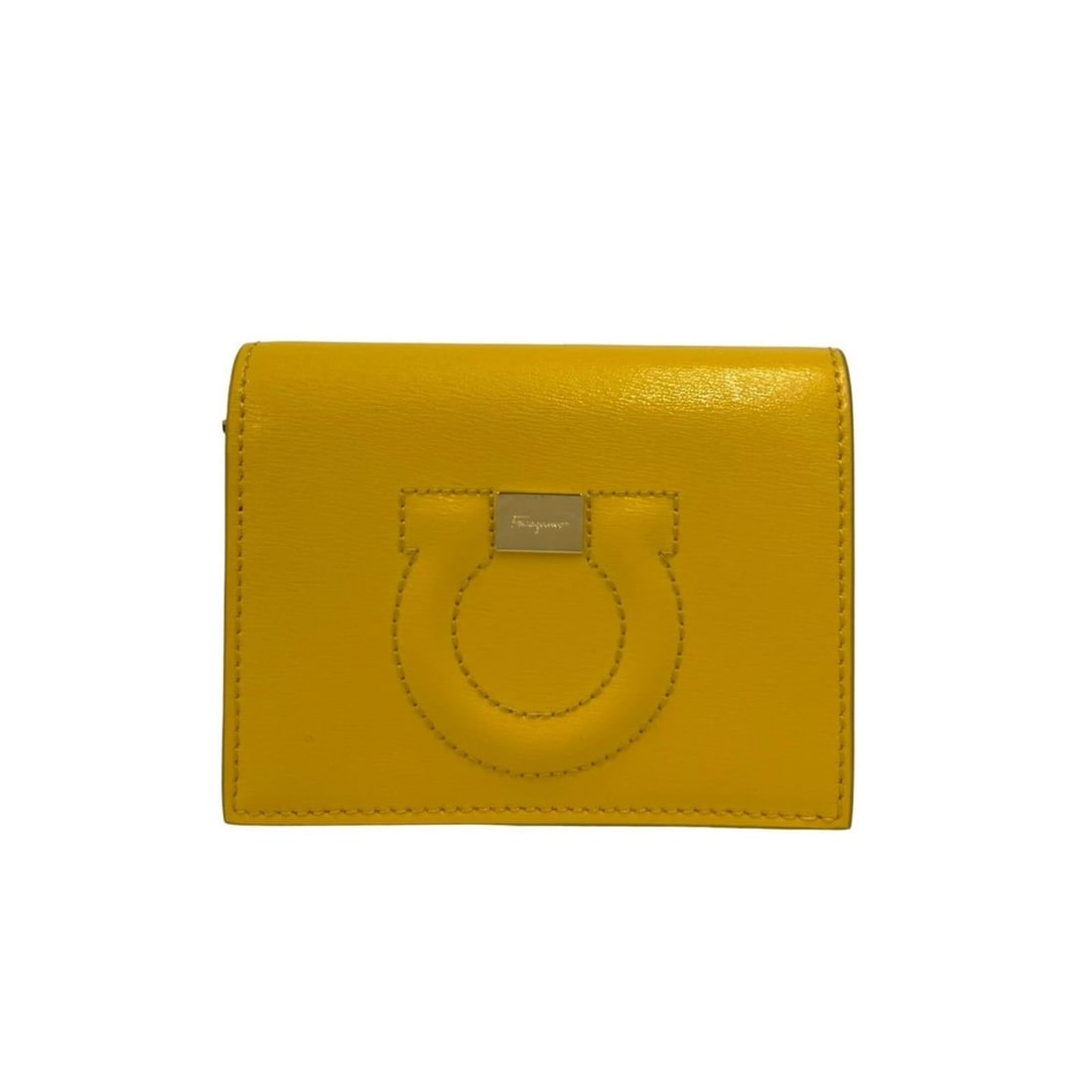 Salvatore Ferragamo Gancini Leather Bi-fold Wallet, Yellow, 32593: --- Catalog ---Category: SizeSize (HxWxD): 9cm x 11cm x 3cm / 3.54'' x 4.33'' x 1.18''Category: DesignType: Wallet (bi-fold)Color: YellowGender: WomenMaterial: Leather Category: GeneralBrand: Salvator