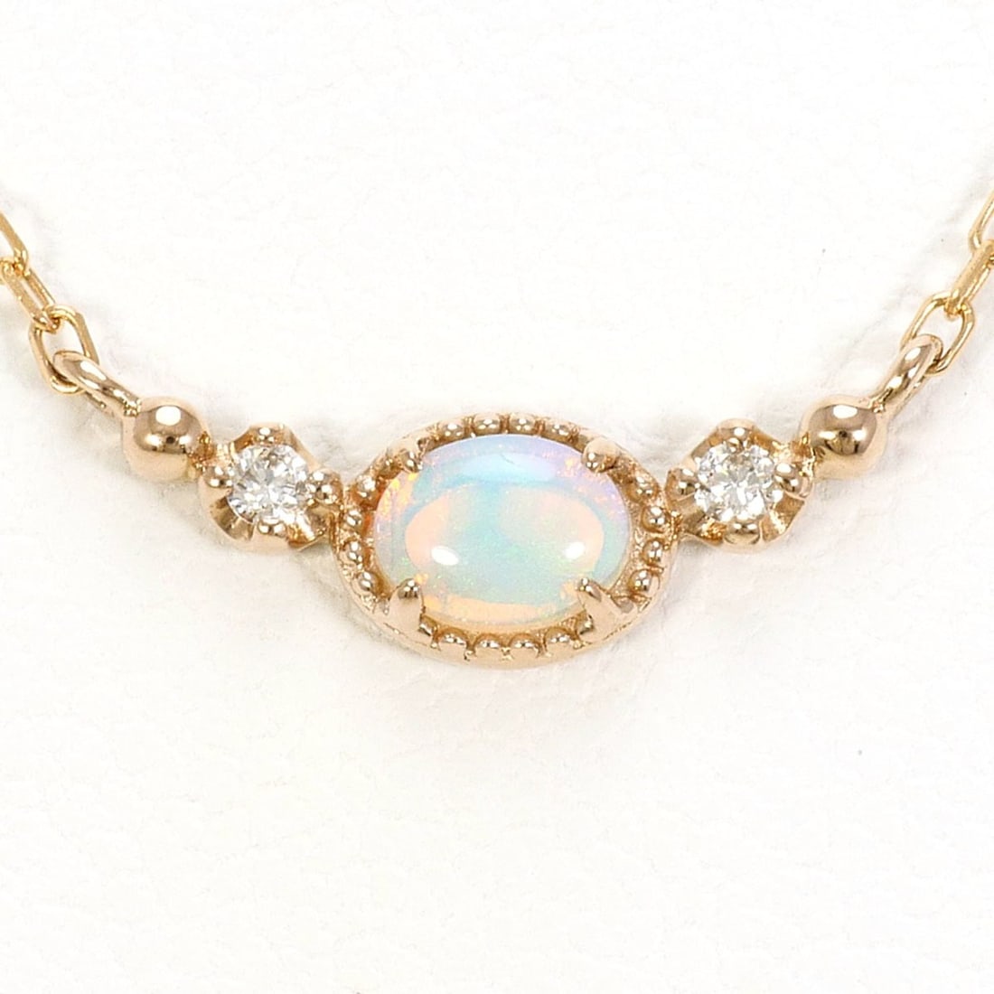18K (18-karat) Pink Gold Necklace with Opal and Diamond (0.02 ct), Total Weight 1.3g, 40cm Length,: --- Catalog ---Category: SizeWeight: 1.3g / 0.04oz.Pendant Size: 4mm x 13mm / 0.15'' x 0.51''Neck Circumference: 40 cm / 15.74''Category: DesignColor: Pink goldMetal: GoldStone: Diamond, OpalGender: W