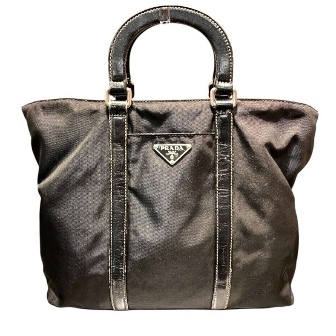 Prada Tessuto Nylon Leather Handbag for Women: --- Catalog ---Category: SizeSize (HxWxD): 22cm x 28cm x 9cm / 8.66'' x 11.02'' x 3.54''Handle Length: 25cm / 9.84''Category: DesignType: HandbagColor: BlackGender: WomenMaterial: Nylon , Leather