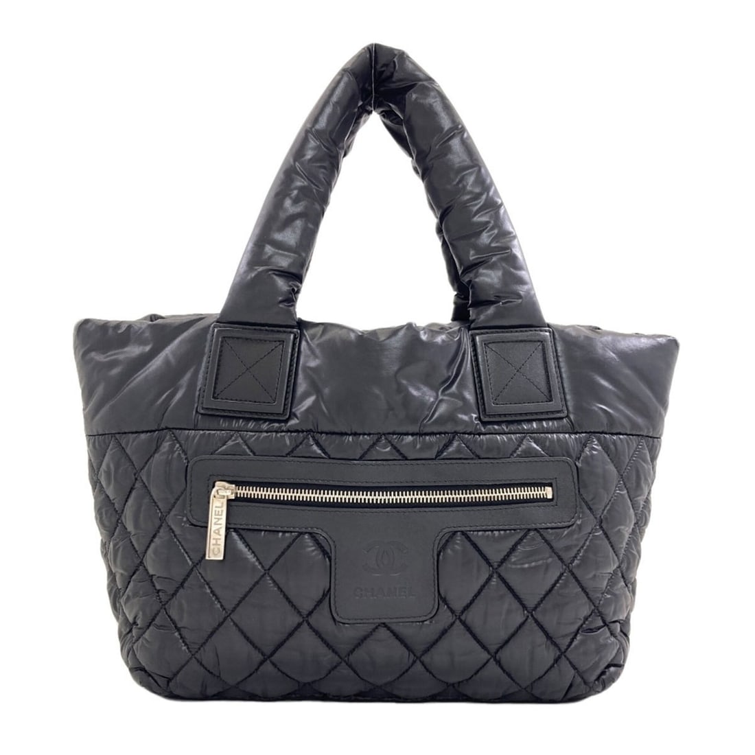 Chanel Coco Cocoon handbag with silver hardware, nylon, for women.: --- Catalog ---Category: SizeSize (HxWxD): 23cm x 28cm x 16cm / 9.05'' x 11.02'' x 6.29''Category: DesignType: HandbagColor: BlackGender: WomenMaterial: Nylon Category: GeneralBrand: Chanel--- Item Li