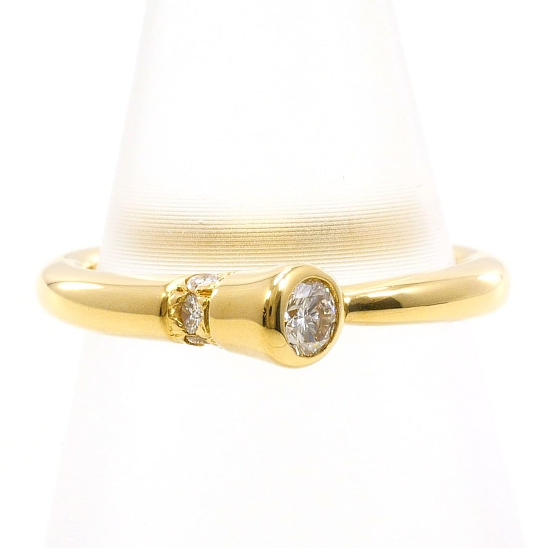 18K (18-karat) Yellow Gold Ring with 0.10ct Diamond, Total Weight 2.0g, Jewelry: --- Catalog ---Category: SizeWeight: 2g / 0.07oz.JP Size: 1.5US Size: 1Category: DesignType: Band ringColor: Yellow goldMetal: GoldStone: DiamondGender: WomenMaterial: Yellow gold (18K)Metal Purity: 1