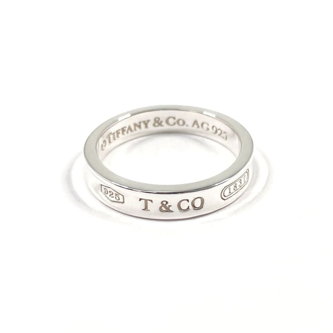 TIFFANY&Co. Tiffany 1837 Narrow Ring, Sterling Silver 925, 14.5cm, Men's: --- Catalog ---Category: SizeJP Size: 14.5US Size: 7.25Category: DesignType: Band ringColor: SilverGender: Men,WomenMaterial: Silver 925Category: GeneralBrand: Tiffany--- Item List ---Section: Conditi