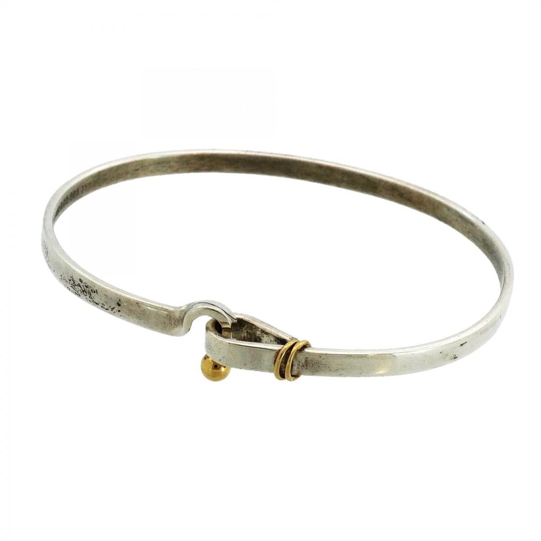 Tiffany & Co. Hook Eye Bangle, 18K Yellow Gold (KYG), Sterling Silver 925, for Men and Women: --- Catalog ---Category: SizeLength: 17.5cm / 6.88''Category: DesignType: BangleGender: Men,WomenMaterial: Silver 925, Yellow gold (18K)Category: GeneralBrand: Tiffany--- Item List ---Section: Conditi