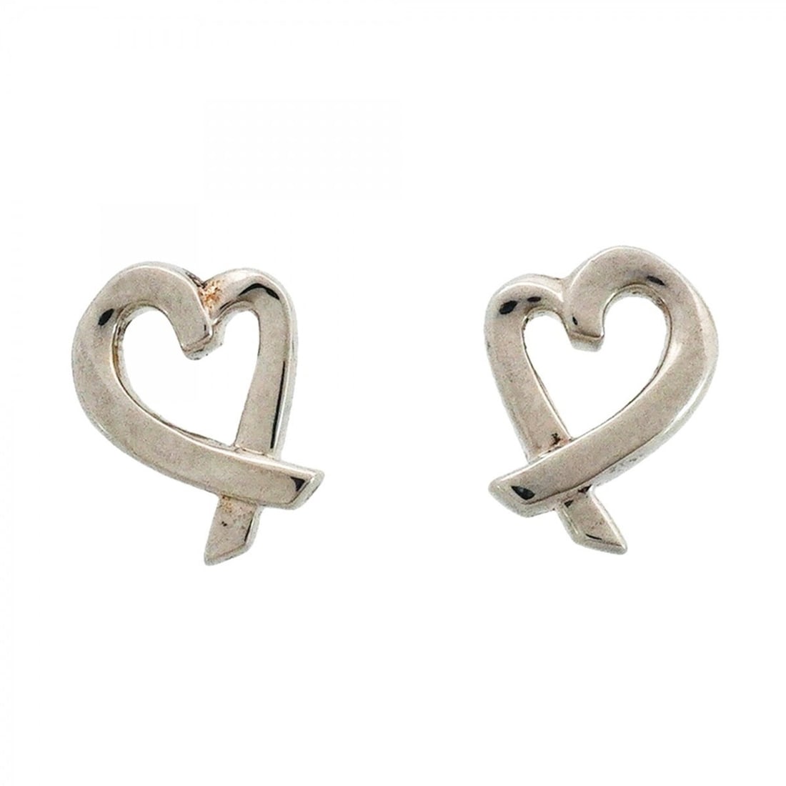 Tiffany & Co. Loving Heart Sterling Silver Earrings for Women: --- Catalog ---Category: SizeSize (HxWxD): 10.30mm x 7.80mm / 0.41'' x 0.31''Category: DesignType: Stud earringsGender: WomenMaterial: Silver 925Category: GeneralBrand: Tiffany--- Item List ---Section