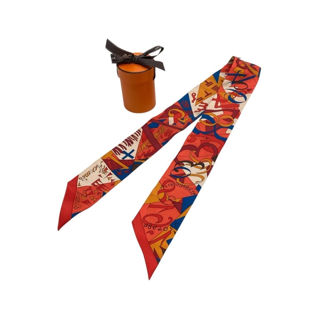 HERMES Twilly Le Nombre d’Or Orange White Red Silk Scarf Muffler Ribbon for Women: --- Catalog ---Category: SizeSize (LxW): 85cm x 5cm / 33.46'' x 1.96''Category: DesignType: ScarfColor: Orange, Red color, WhiteGender: WomenMaterial: Silk Category: GeneralBrand: HermesCountry of