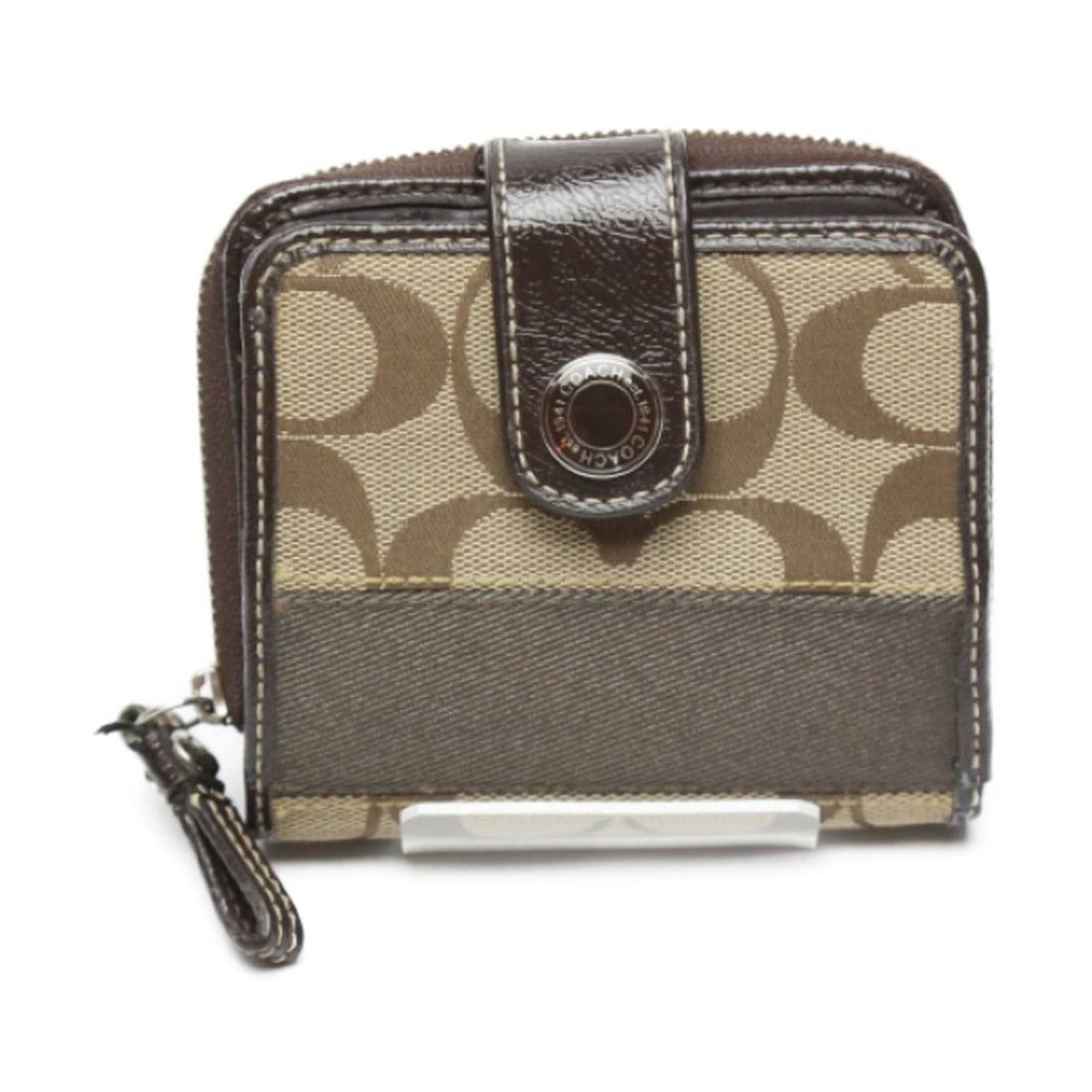 Coach bifold wallet in signature canvas and patent leather with a round zipper, brown (1 of 13)