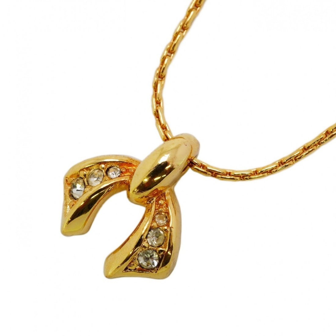 Christian Dior Necklace Ribbon Motif GP Plated Rhinestone Gold Ladies: --- Catalog ---Category: SizePendant Size: 15.4mm x 14.1mm / 0.6'' x 0.55''Neck Circumference: 38.5 cm - 43.5 cm / 15.15'' - 17.12''Category: DesignColor: GoldStone: RhinestoneGender: WomenMaterial: G