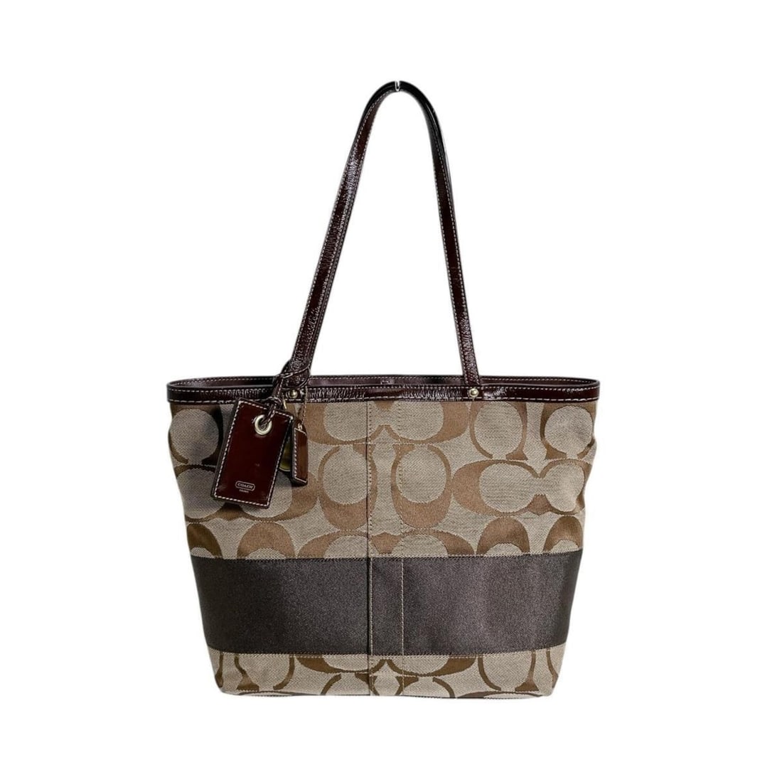 Coach tote bag, canvas, signature pattern, 10124 brown: --- Catalog ---Category: SizeSize (HxWxD): 22cm x 34cm x 9cm / 8.66'' x 13.38'' x 3.54''Category: DesignType: Tote bagColor: BrownGender: WomenMaterial: Canvas Category: GeneralMPN: 10124Brand: CoachC