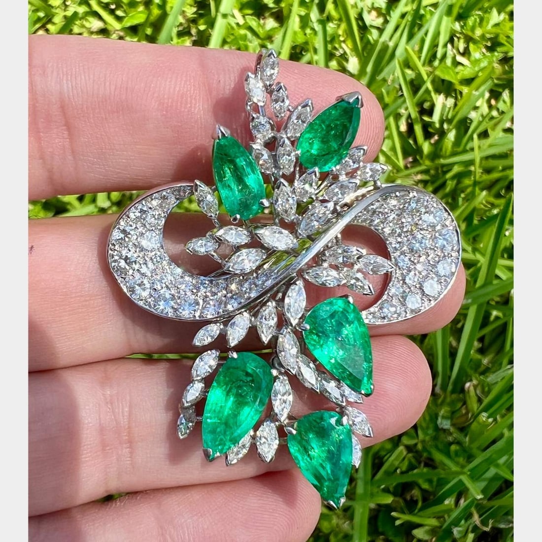 1960’s 14K White Gold Colombian Emerald & Diamond Brooch: 1960’s 14K White Gold Colombian Emerald & Diamond BroochSet with 5 Colombian Emeralds weighing app. 15.00 Ct.Along with 50 Diamonds weighing app. 4.50 Ct.And 39 Diamonds weighing app. 5.00 Ct.F-H Co