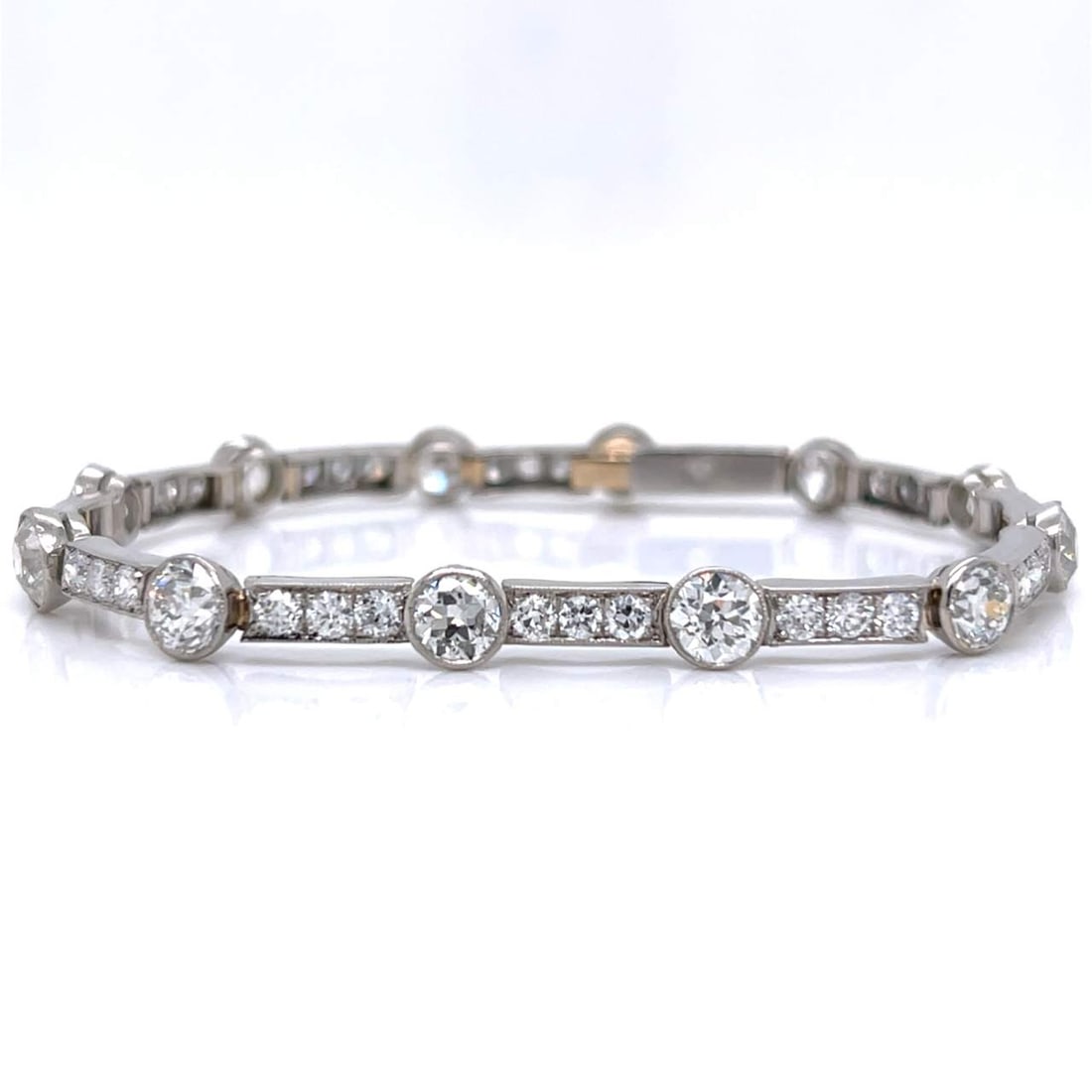 Art Deco Platinum Diamond Bracelet: Art Deco Platinum Diamond BraceletWeighing 17.7 gramsSet with 12 European-cut Diamonds weighing app. 7.80 Ct.G-H Color, VS1-SI1 ClarityAnd 36 European-cut Diamonds weighing app. 3.00 Ct.F-G Color,