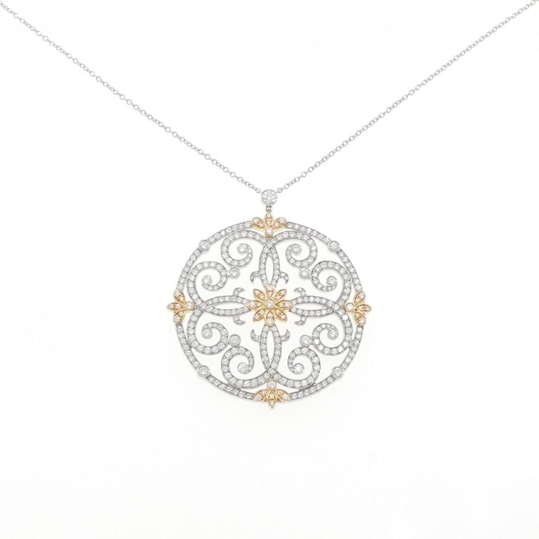 Tiffany Scroll Necklace: --- Catalog ---Category: SizeWidth: 0.7mm / 0.03''Weight: 13.9g / 0.49oz.Pendant Size: 40.2mm x 35.7mm / 1.58'' x 1.4''Neck Circumference: 57 cm / 22.44''Category: DesignStone: DiamondGender: WomenMat