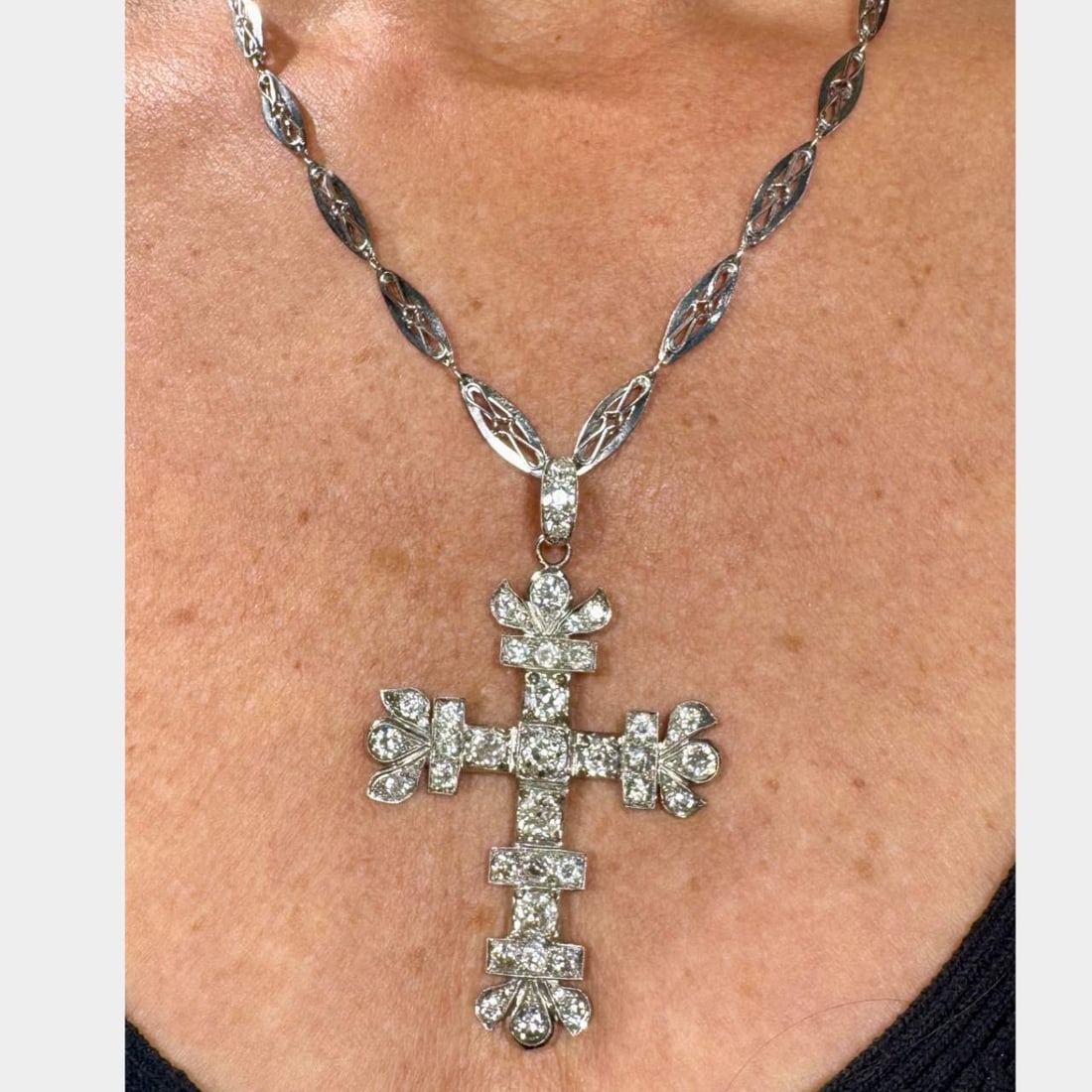 Art Deco Platinum Diamond Cross Necklace: Art Deco Platinum Diamond Cross NecklaceWeighing 37.4 gramsSet with 44 Old Mine Diamonds weighing app. 10.90 Ct.H-J Color, VS1-I1 ClarityCross is 3 inches in lengthChain is 18.5 inches in length