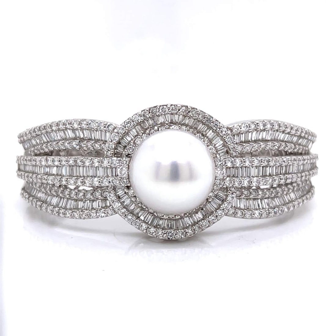 18K White Gold South Sea Pearl & Diamond Bangle: 18K White Gold South Sea Pearl & Diamond BangleWeighing 67.4 gramsSet with 250 Diamonds weighing app. 6.25 Ct.Along with 210 Diamonds weighing app. 6.00 Ct.F-G Color, VS1-SI1 ClarityAnd a 16.4mm