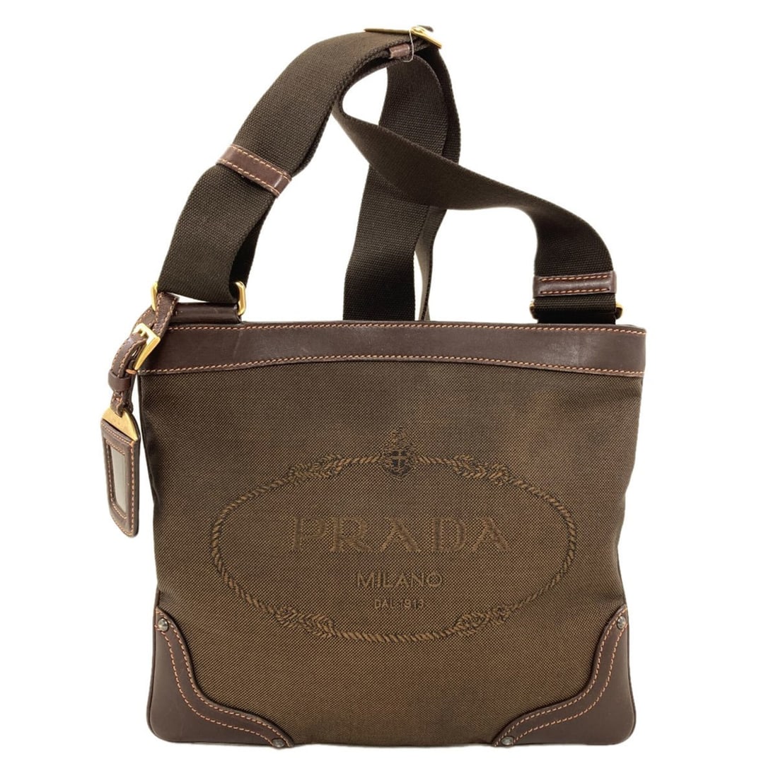 Prada Logo Shoulder Bag, Canvas/Calfskin, Women's PRADA: --- Catalog ---Category: SizeSize (HxWxD): 22.5cm x 26cm x 1cm / 8.85'' x 10.23'' x 0.39''Strap Length: 68cm - 118cm / 26.77'' - 46.45''Category: DesignType: Shoulder bagColor: Dark brownGender: Women