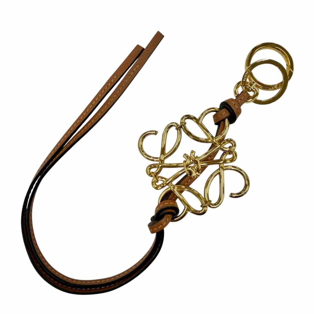 LOEWE C821232X01 Classic Calf Tan Anagram Keychain Bag Charm with Gold Hardware, Made in Spain,: --- Catalog ---Category: DesignType: KeyringColor: GoldGender: WomenCategory: GeneralMPN: C821232X01Brand: LoeweCountry of Origin: Spain--- Item List ---Section: ConditionRanking: Rank A Used - A few 