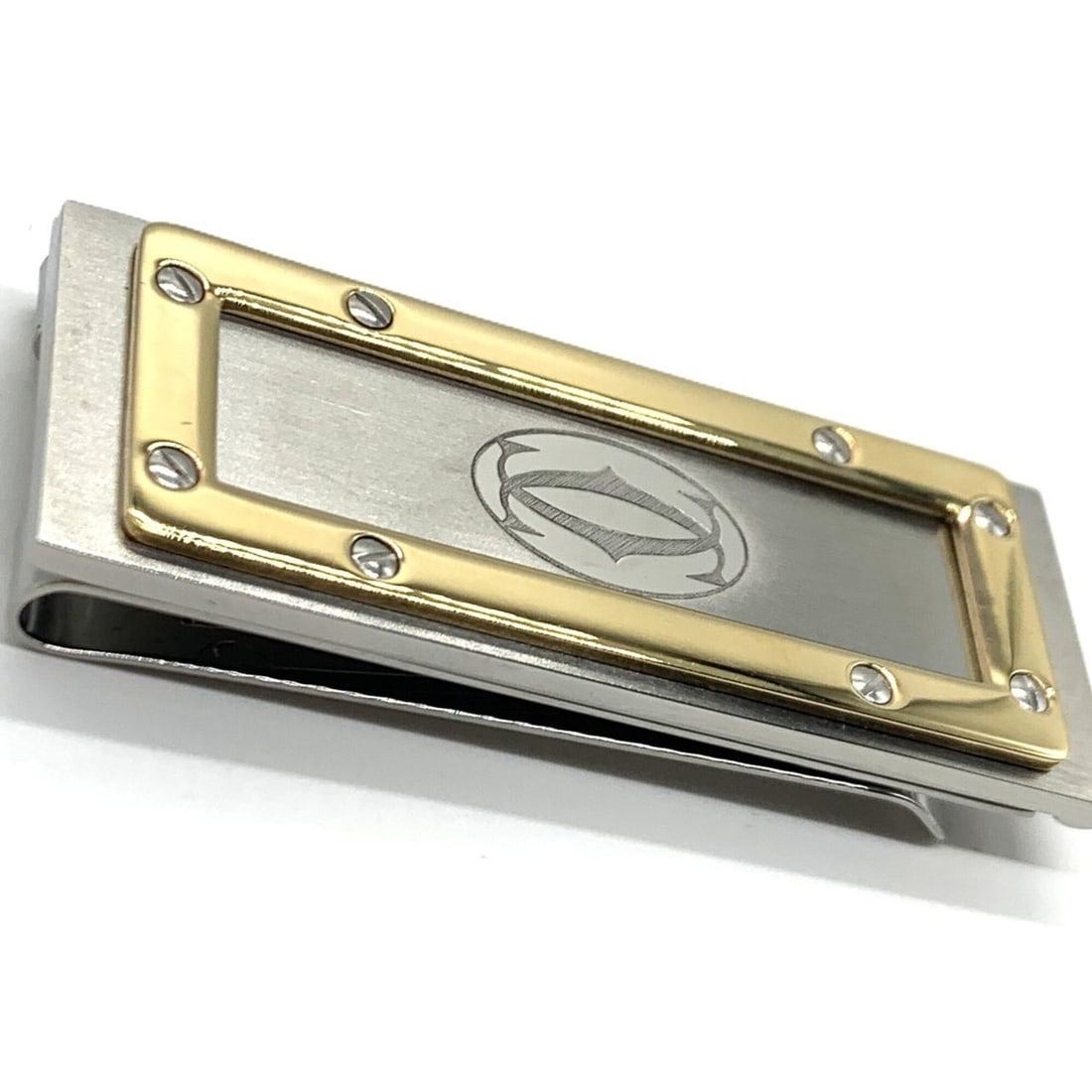 Cartier Santos de Money Clip Stainless Steel Gold Silver: --- Catalog ---Category: SizeSize (HxWxD): 5cm x 2cm / 1.96'' x 0.78''Category: DesignType: Money clipGender: Women,MenMaterial: Stainless steel Category: GeneralLine: SantosBrand: Cartier--- Item Lis