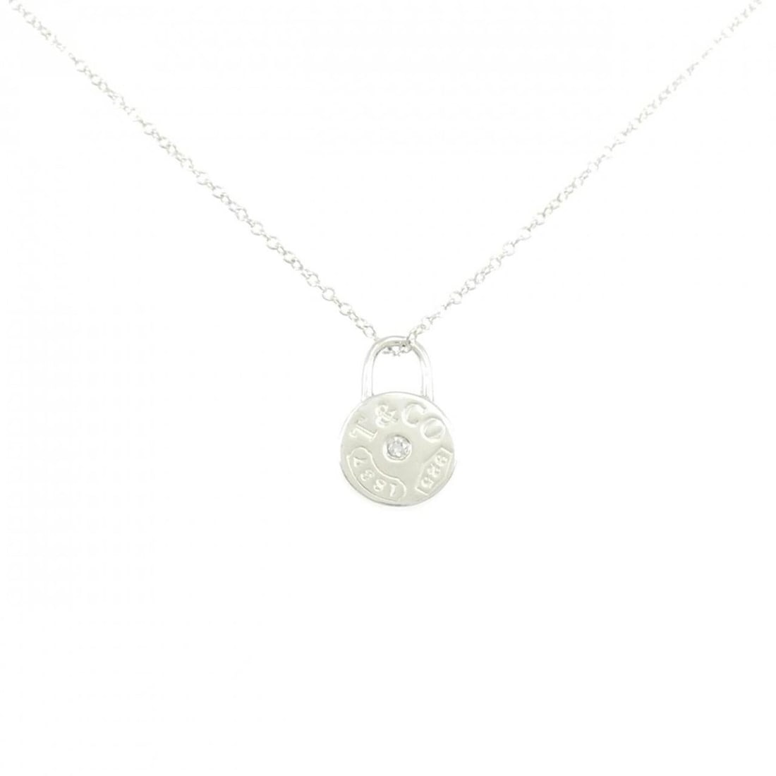 Tiffany & Co. 1837 Round Lock Necklace: --- Catalog ---Category: SizePendant Size: 13.2mm x 8.6mm / 0.51'' x 0.33''Neck Circumference: 41 cm / 16.14''Category: DesignColor: SilverStone: DiamondGender: WomenMaterial: Silver 925Pendant Type: