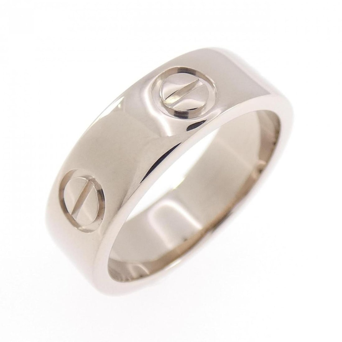 Cartier Love Ring: --- Catalog ---Category: SizeUS Size: 5Brand Size: 49Category: DesignType: Band ringGender: WomenMaterial: White gold (18K)Category: GeneralBrand: Cartier--- Item List ---Section: ConditionRanking: