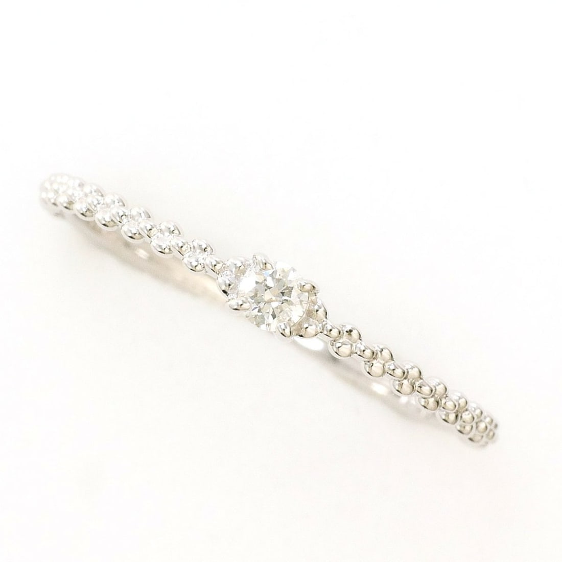 K10 10K WG White Gold Ring with 1 Diamond (0.06 ct), Total Weight 0.9g, Like New Condition.: --- Catalog ---Category: SizeWidth: 3mm / 0.12''Weight: 0.9g / 0.03oz.JP Size: 12US Size: 6.5Category: DesignType: Band ringColor: White goldMetal: White GoldStone: DiamondGender: WomenMaterial: White