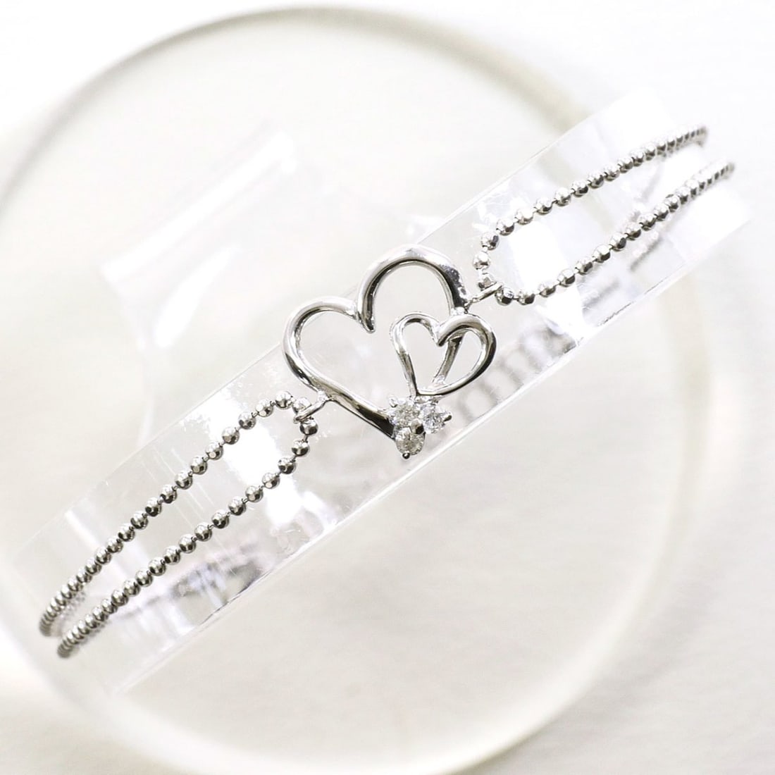 K14 14K WG White Gold Bracelet with Diamond (no carat marking), Total Weight 1.5g, 18cm, Like New: --- Catalog ---Category: SizeLength: 18cm / 7.08''Weight: 1.5g / 0.05oz.Category: DesignType: Charm braceletColor: White goldMetal: White GoldStone: DiamondGender: WomenMaterial: White gold (14K)Metal