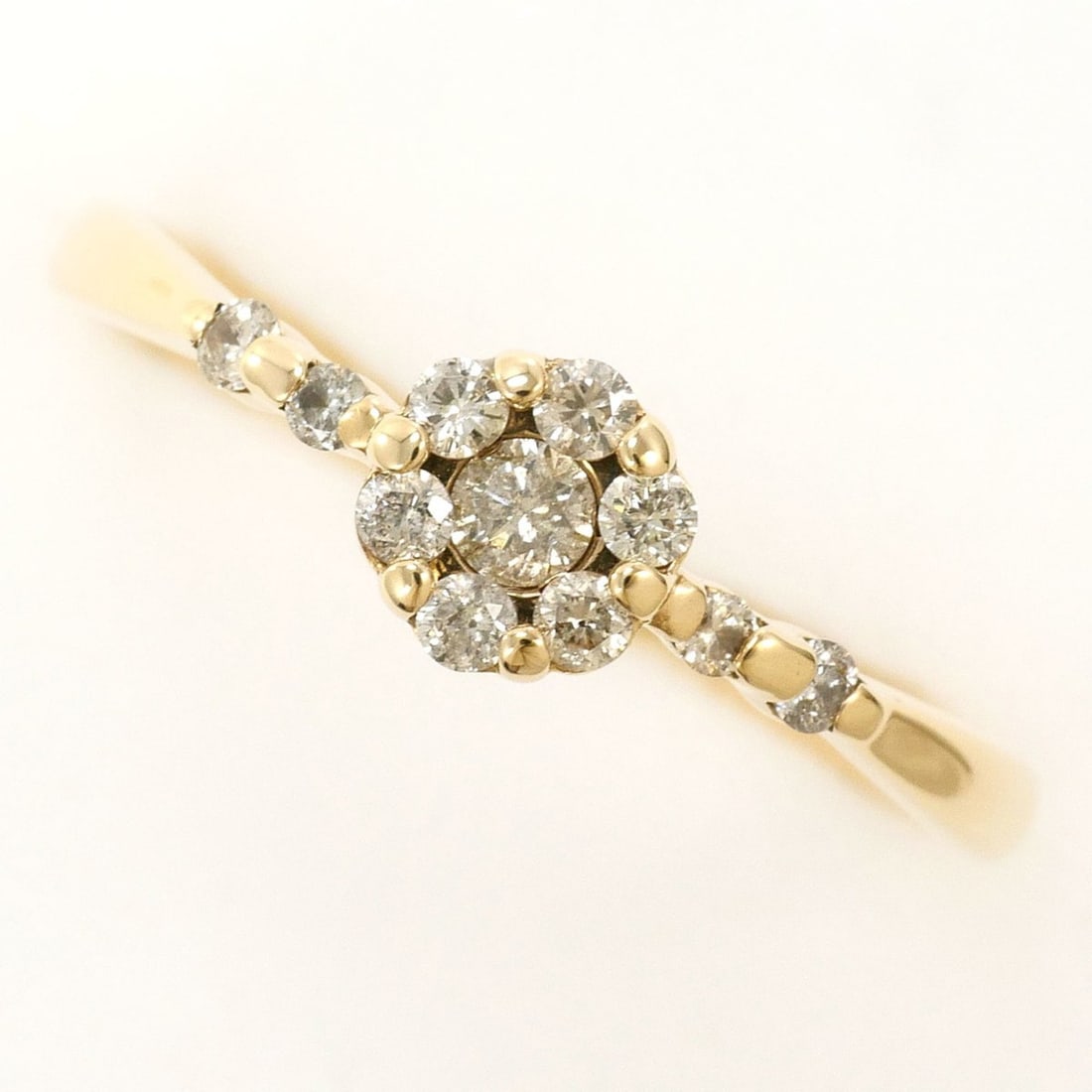 K10 10K YG Yellow Gold Ring with 1 Diamond (0.20 ct), Total Weight 1.1g, Like New Condition.: --- Catalog ---Category: SizeWidth: 5mm / 0.2''Weight: 1.1g / 0.03oz.JP Size: 12US Size: 6.5Category: DesignType: Band ringColor: Yellow goldMetal: GoldStone: DiamondGender: WomenMaterial: Yellow gold