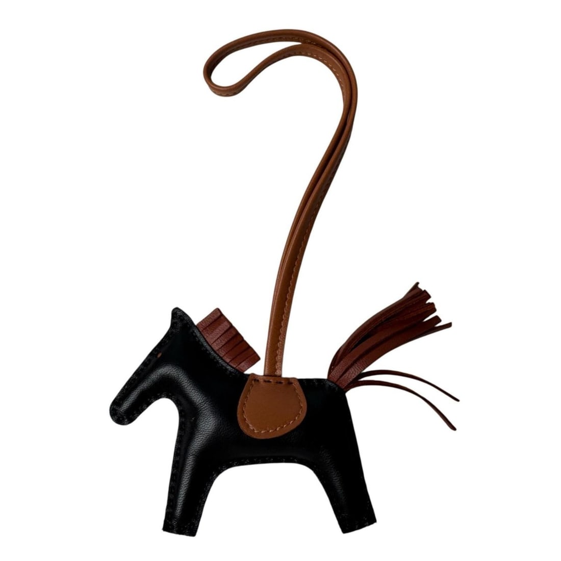 Hermes Rodeo Charm PM Black Sienne Gold Lambskin W Stamp Women's: --- Catalog ---Category: SizeSize (HxWxD): 70.00mm x 80.00mm / 2.76'' x 3.15''Category: DesignType: Handbag charmColor: Black, Gold, SienneGender: WomenMaterial: Agneau MiloCategory: GeneralBrand: Her