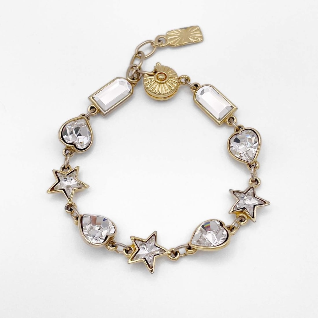 YVES SAINT LAURENT Clear Stone Heart Star Bracelet Bangle Vintage Gold Women's: --- Catalog ---Category: SizeLength: 18cm / 7.08''Category: DesignType: Charm braceletColor: GoldGender: WomenCategory: GeneralBrand: Yves Saint Laurent--- Item List ---Section: ConditionRanking: Rank