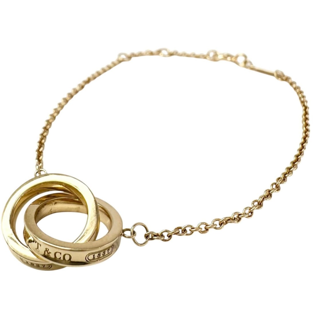 TIFFANY & Co. Interlocking 1837 Bracelet AU750 Gold Women's: --- Catalog ---Category: SizeLength: 17.8cm / 7''Category: DesignType: Charm braceletColor: GoldGender: WomenMaterial: Gold (18K)Category: GeneralBrand: Tiffany--- Item List ---Section: ConditionRanki