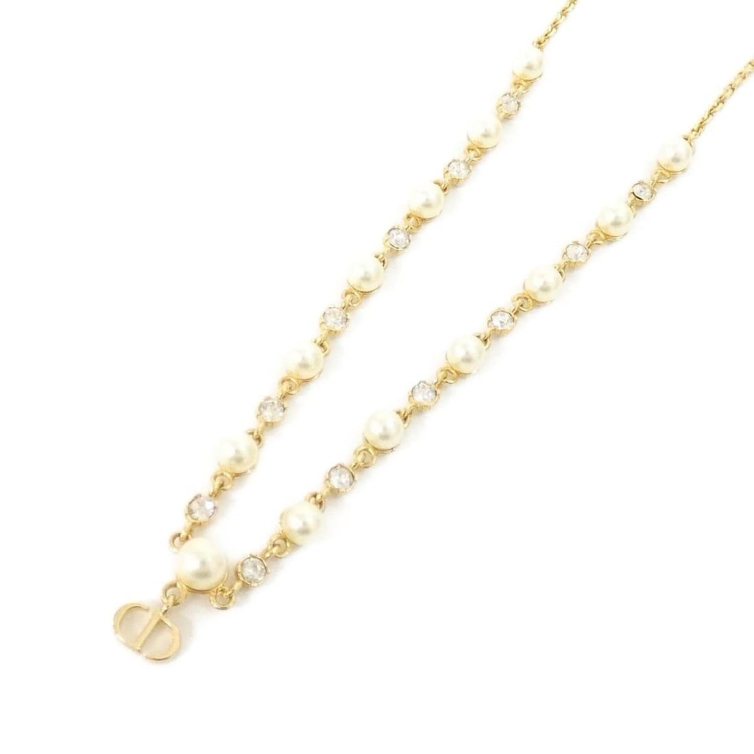 Christian Dior Petite CD Treasure N2852WOMCY Necklace: --- Catalog ---Category: SizePendant Size: 7mm x 8mm / 0.27'' x 0.31''Neck Circumference: 39.5 cm - 42.5 cm / 15.55'' - 16.73''Category: DesignColor: Clear, Gold, WhiteGender: WomenNecklace Type: