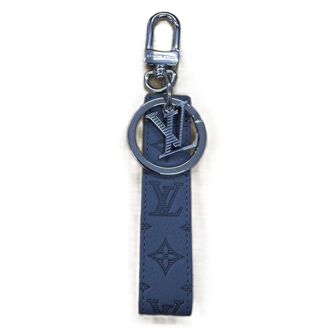 Louis Vuitton M82373 Monogram Dragonne Keychain Bag Charm, Gray Leather: --- Catalog ---Category: SizeSize (HxWxD): 15cm x 3.7cm / 5.9'' x 1.45''Category: DesignType: KeyringColor: GrayGender: Women,MenMaterial: LeatherCategory: GeneralLine: MonogramBrand: Louis