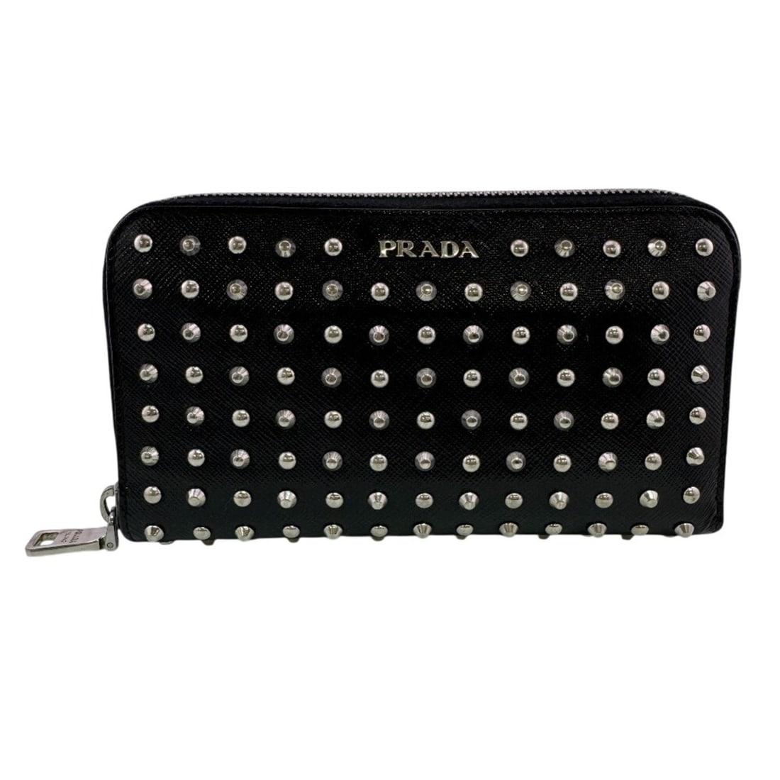 PRADA 1M0506 Round Zipper Studded Long Wallet, Black: --- Catalog ---Category: SizeSize (HxWxD): 11cm x 19cm / 4.33'' x 7.48''Category: DesignColor: BlackGender: WomenMaterial: Leather Category: GeneralMPN: 1M0506Brand: Prada--- Item List ---Section: Con