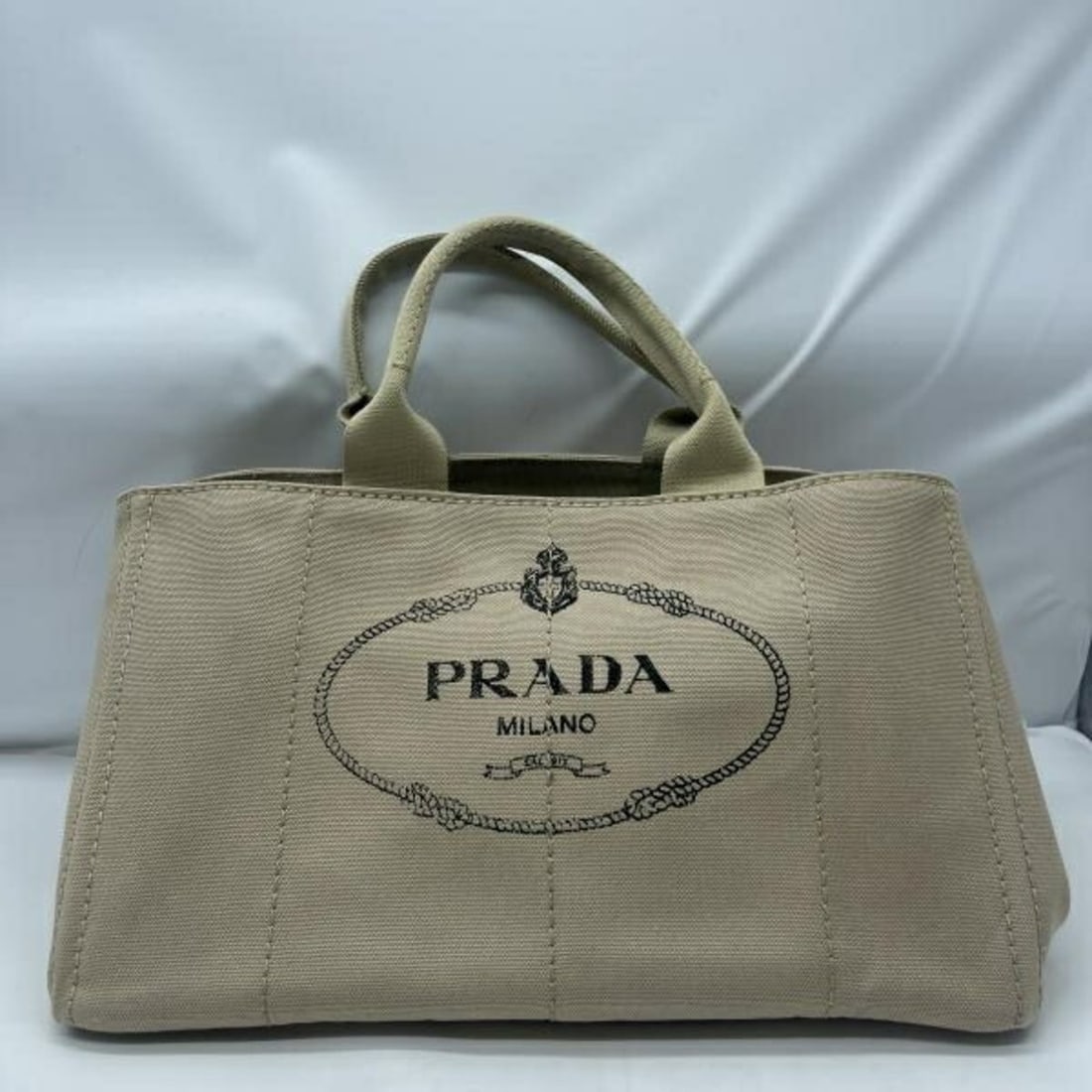 PRADA Canapa Tote Bag, Size L, Beige, BM1872: --- Catalog ---Category: SizeSize (HxWxD): 23cm x 41cm x 25cm / 9.05'' x 16.14'' x 9.84''Category: DesignType: Tote bagColor: BeigeGender: WomenCategory: GeneralLine: CanapaBrand: Prada--- Item List