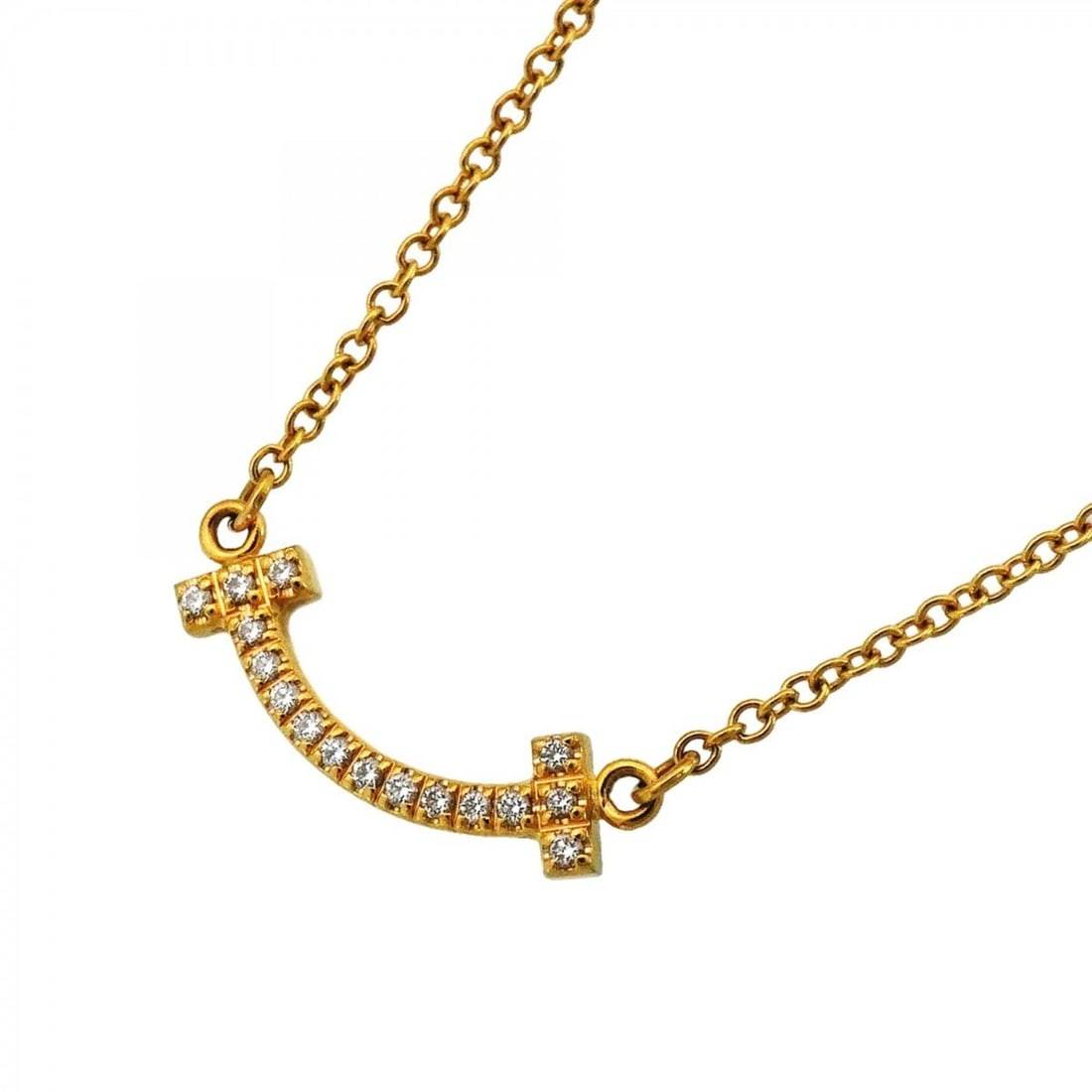 Tiffany & Co. T Smile Mini Necklace, 18K Yellow Gold, Diamond, Women's: --- Catalog ---Category: SizePendant Size: 4.7mm x 14.5mm / 0.18'' x 0.57''Neck Circumference: 41 cm - 46 cm / 16.14'' - 18.11''Category: DesignStone: DiamondGender: WomenMaterial: Yellow gold (18K)Ne