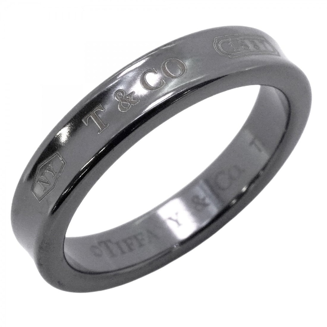 Tiffany & Co. Narrow Titanium Black Ring, Size 15 (Men's/Women's): --- Catalog ---Category: SizeJP Size: 15US Size: 7.5Category: DesignType: Band ringColor: BlackGender: Men,WomenMaterial: TitaniumCategory: GeneralBrand: Tiffany--- Item List ---Section: ConditionRank