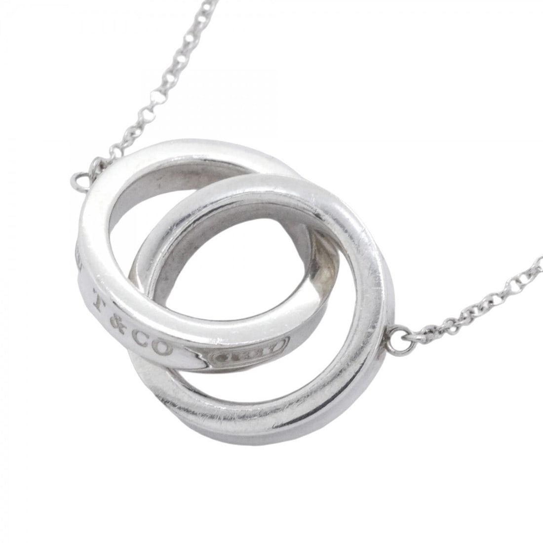Tiffany & Co. Interlocking Sterling Silver Necklace for Women: --- Catalog ---Category: SizePendant Size: 14.2mm x 23.9mm / 0.55'' x 0.94''Neck Circumference: 40 cm / 15.74''Category: DesignGender: WomenMaterial: Silver 925Necklace Type: NecklaceCategory: General