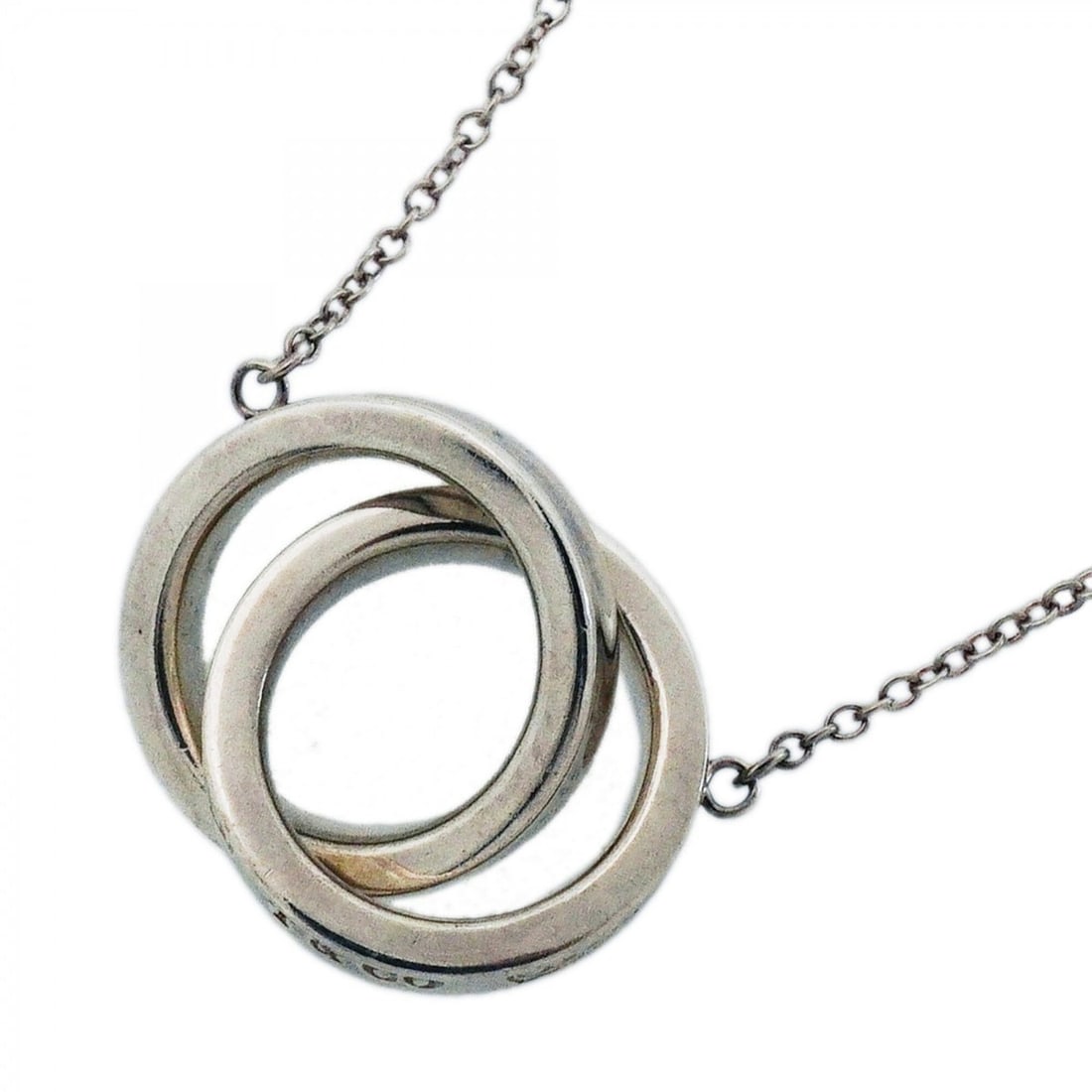 Tiffany & Co. Interlocking Necklace 1837, Sterling Silver 925, Women's: --- Catalog ---Category: SizePendant Size: 14.8mm x 22.4mm / 0.58'' x 0.88''Neck Circumference: 41 cm / 16.14''Category: DesignGender: WomenMaterial: Silver 925Necklace Type: NecklaceCategory: General