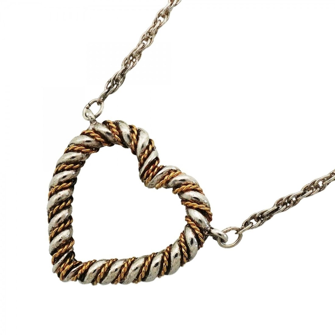 Tiffany & Co. Twist Heart Necklace, 18K Yellow Gold (KYG), Sterling Silver 925, Women's: --- Catalog ---Category: SizePendant Size: 21mm x 25.4mm / 0.82'' x 0.99''Neck Circumference: 49 cm / 19.29''Category: DesignGender: WomenMaterial: Silver 925, Yellow gold (18K)Necklace Type: Necklace