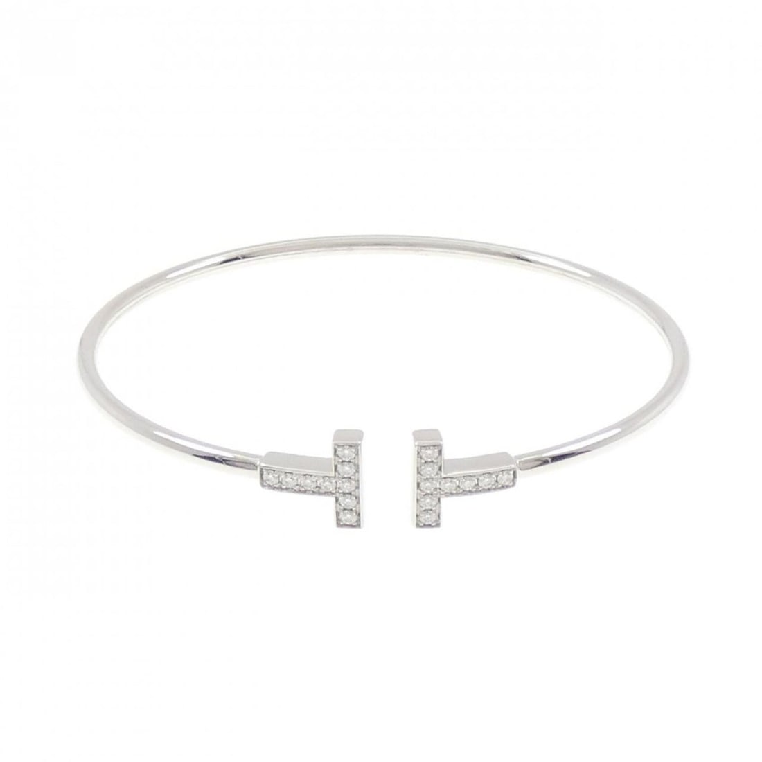 Tiffany T Wire Bangle: --- Catalog ---Category: SizeLength: 17.5cm / 6.88''Category: DesignType: BangleGender: WomenMaterial: White gold (18K)Category: GeneralBrand: Tiffany--- Item List ---Section: ConditionRanking: Rank