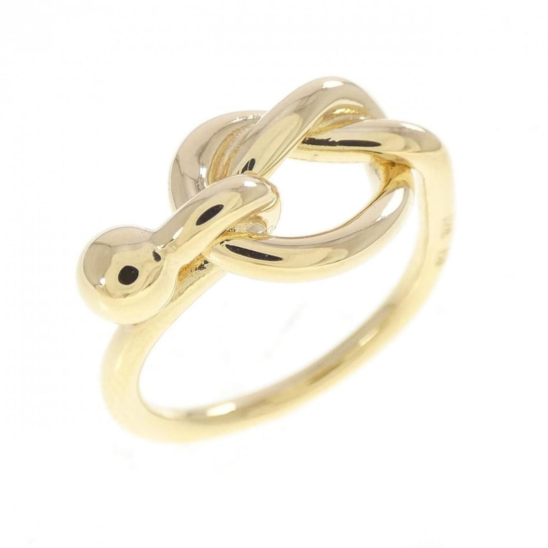 Tiffany Love Knot Ring: --- Catalog ---Category: SizeWeight: 3.8g / 0.13oz.JP Size: 7.5US Size: 4Category: DesignType: Band ringGender: WomenMaterial: Yellow gold (18K)Category: GeneralBrand: Tiffany--- Item List ---Section: