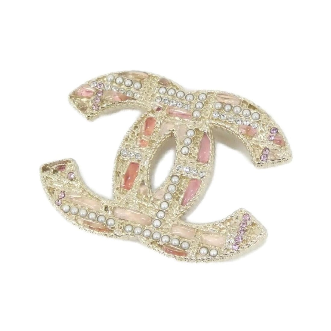 Chanel brooch: --- Catalog ---Category: SizeSize (HxWxD): 3.5cm x 4.6cm / 1.37'' x 1.81''Category: DesignType: BroochColor: Pink, WhiteStone: CrystalGender: WomenCategory: GeneralBrand: Chanel--- Item List