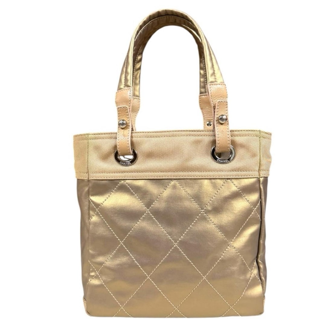 Chanel Paris Biarritz PM Tote Bag, Coated Canvas A34208 Gold, Women's CHANEL: --- Catalog ---Category: SizeSize (HxWxD): 27cm x 30cm x 11cm / 10.62'' x 11.81'' x 4.33''Category: DesignType: Tote bagColor: GoldGender: WomenMaterial: Coated canvas , PVC , Leather Category: Genera